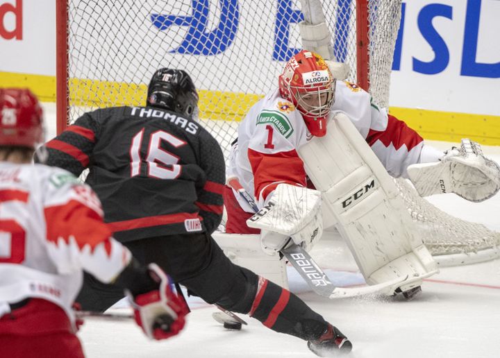 Canada's Akil Thomas scores the fourth goal on Russia's goaltender Amir Miftakhov in the gold medal game at the World Junior Hockey Championships, Sunday, January 5, 2020 in Ostrava, Czech Republic. 