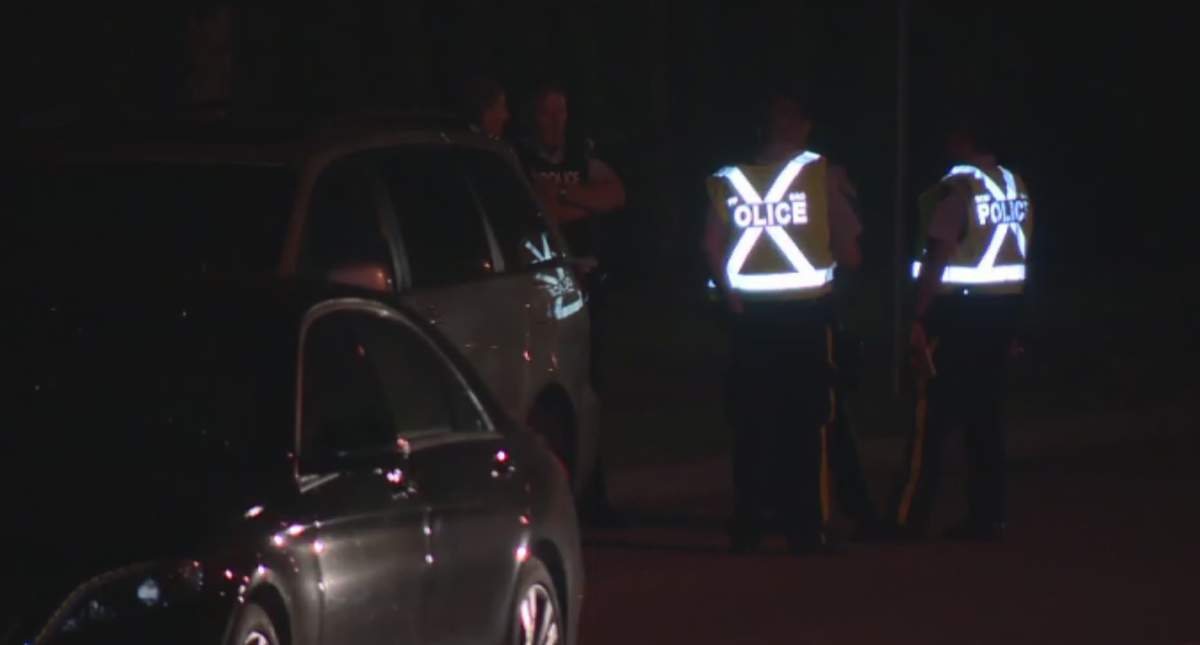 Coquitlam RCMP investigators at the scene of a vehicle/pedestrian collision Monday evening that seriously injured a woman and sent a 3-year-old child to hospital with life-threatening injuries.