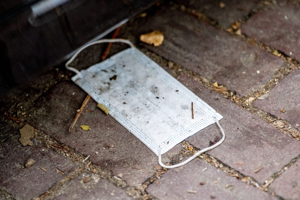 A discarded face mask is shown in this file photo from July 28, 2020.