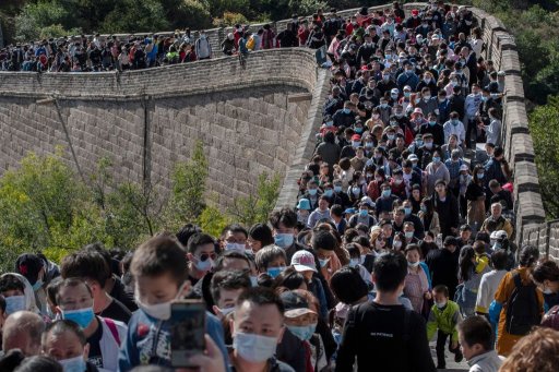 Chinese tourists crowd in a bottleneck as they move slowly on a section of the Great Wall at Badaling after tickets sold out during the ‘Golden Week’ holiday on Oct. 4, 2020 in Beijing, China.