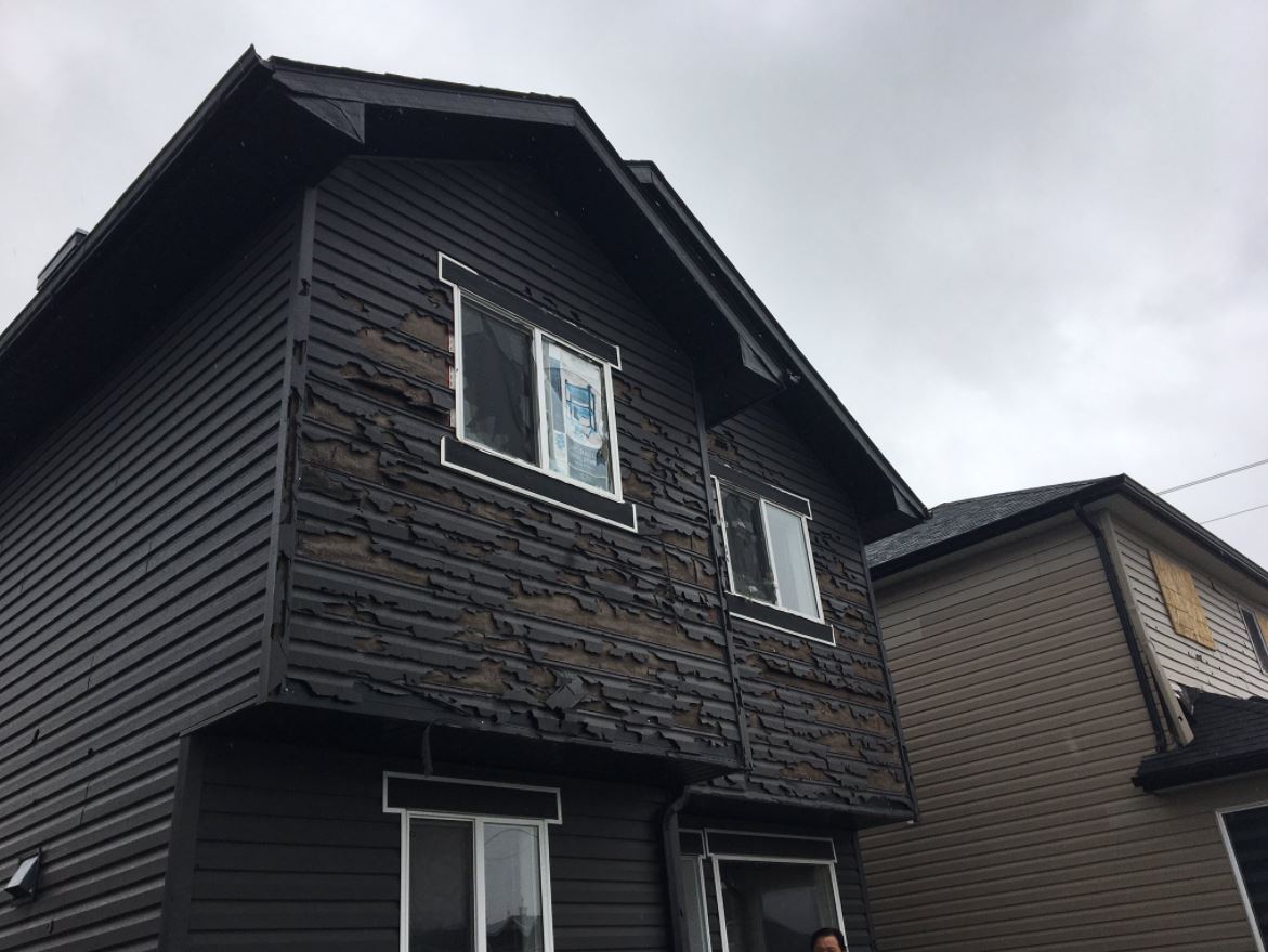 The west facing side of Louie Adriano’s home in northeast Calgary.