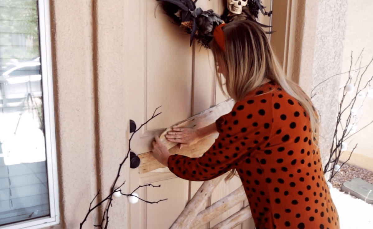 One Winnipegger sets up Halloween decorations outside her house amid the COVID-19 pandemic.