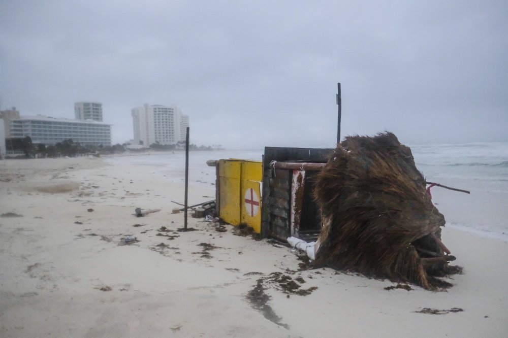 A lifeguard tower lays on its side after it was toppled over by Hurricane Delta in Cancun, Mexico, early Wednesday, Oct. 7, 2020. 