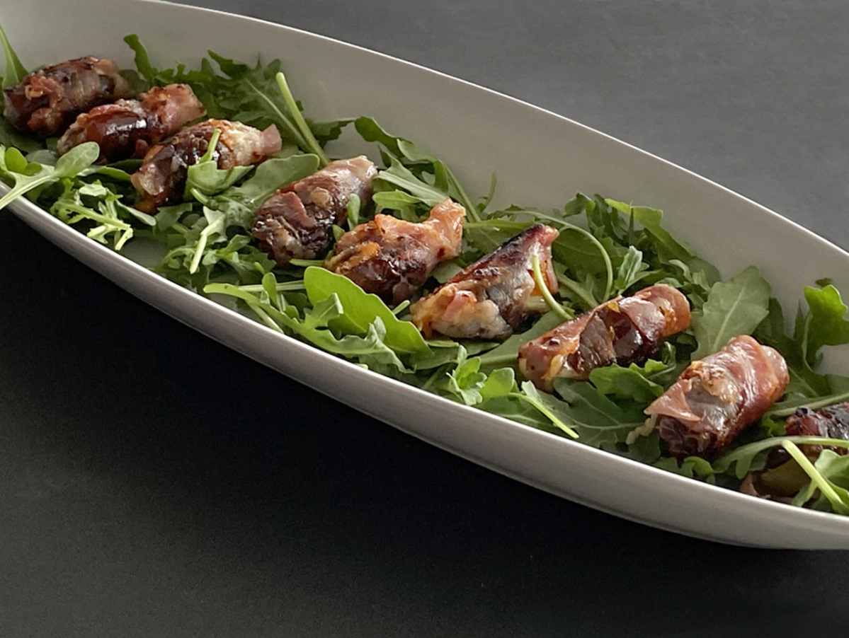 These pancetta-wrapped dates are quick, easy, and won't fill your guests up too much before dinner. 