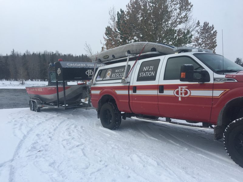 Members of the Calgary Fire Department take part in the annual search of the Bow River.