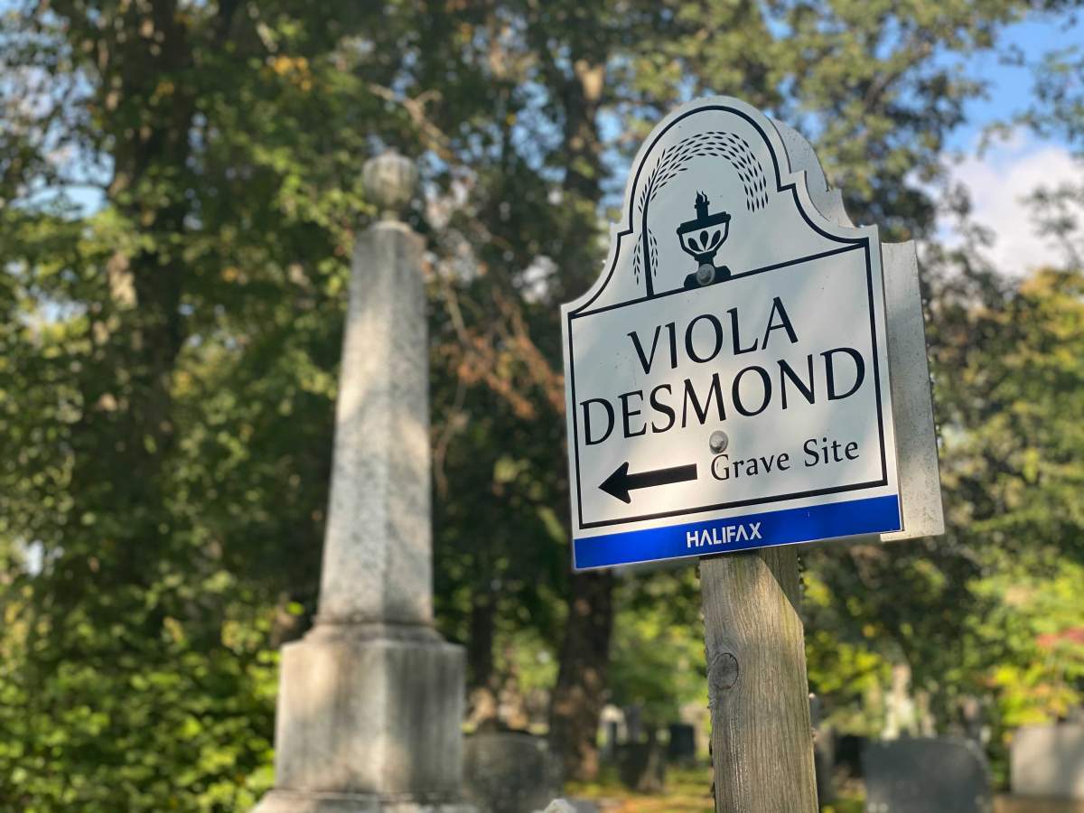 A sign directs visitors to the gravesite of Viola Desmond at the Camp Hill Cemetery in Halifax.