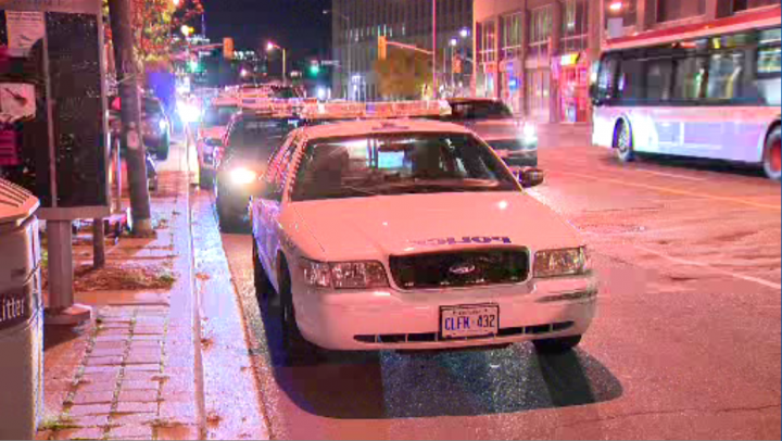 Police at the scene of a shooting in the area of Yonge Street and Davisville Avenue on Saturday.