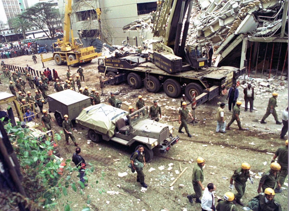 FILE - In this Sunday, Aug. 9, 1998 file photo, Israeli soldiers bring in heavy lifting equipment to the wreckage of the Ufundi House, adjacent to the U.S. embassy in Nairobi. The United States and Israel worked together to track and kill Abu Mohammed al-Masri, a senior al-Qaida operative in Iran earlier this year, a bold intelligence operation by the two allied nations that came as the Trump administration was ramping up pressure on Tehran. Al-Masri was gunned down in a Tehran alley on August 7, 2020 the anniversary of the 1998 bombings of the U.S. embassies in Nairobi, Kenya, and Dar es Salaam, Tanzania. Al-Masri was widely believed to have participated in the planning of those attacks and was wanted on terrorism charges by the FBI. 
