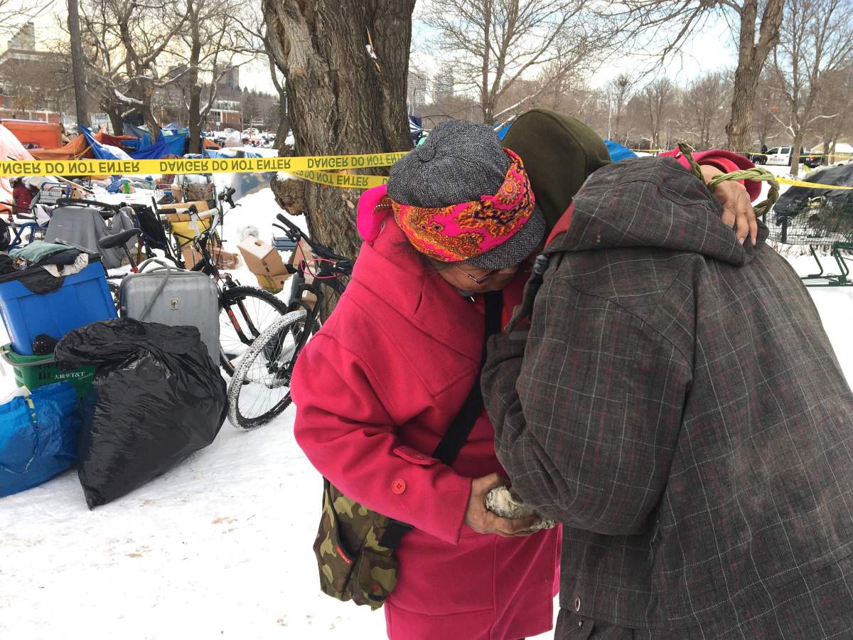 City staff and police officers officially close Camp Pekiwewin in Rossdale on Nov. 12, 2020.