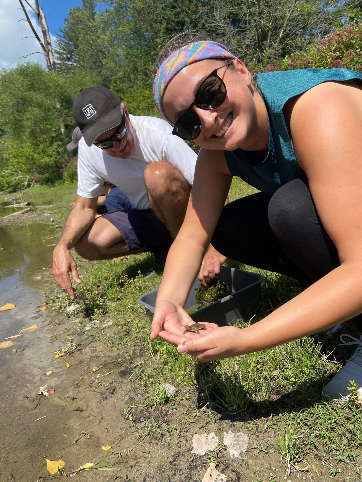 Dispenser Amenities staff releasing turtles.