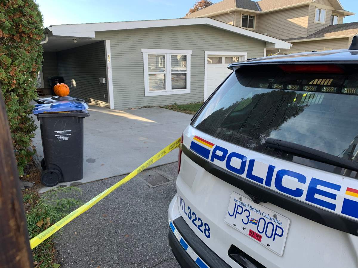Police tape surrounds a home and an RCMP cruiser was on scene at 685 Old Meadows Road on Sunday.