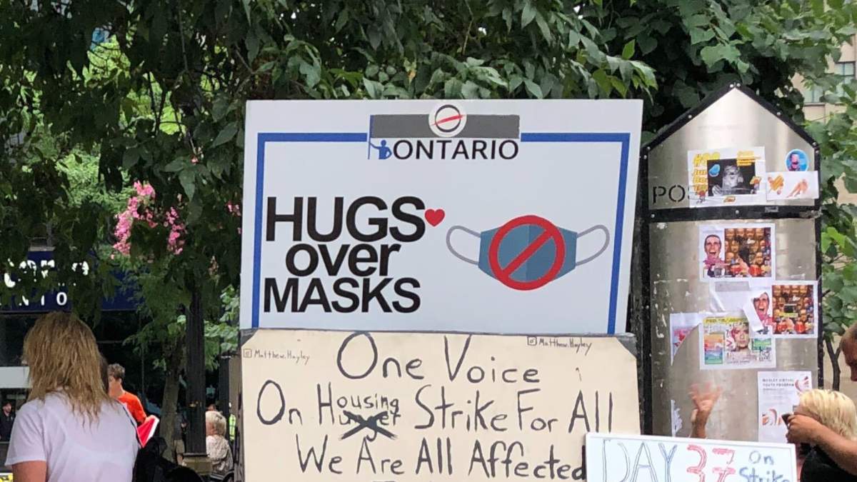 3 charged after Hugs Over Masks protest at Hamilton city hall - image