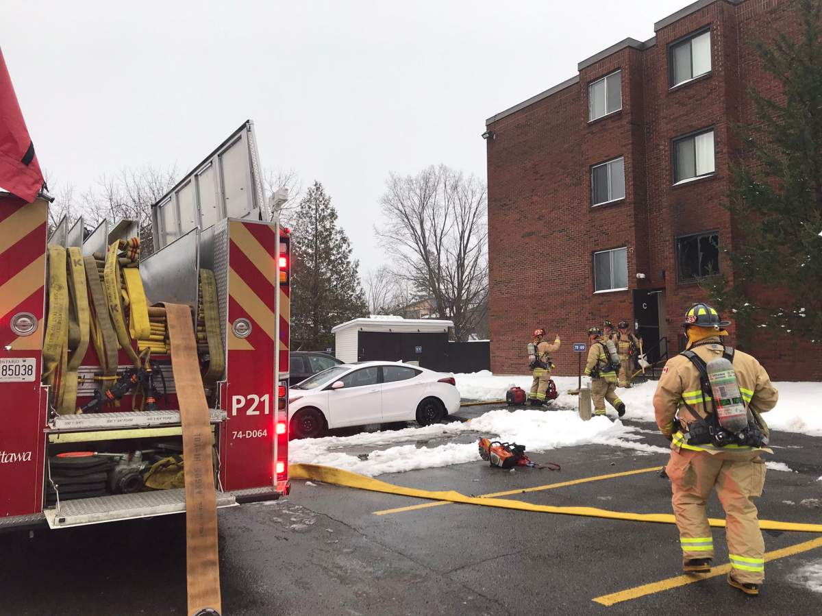 Crews put out a fire on the second storey of an apartment building on Baseline Road on Thursday, Nov. 26, 2020.
