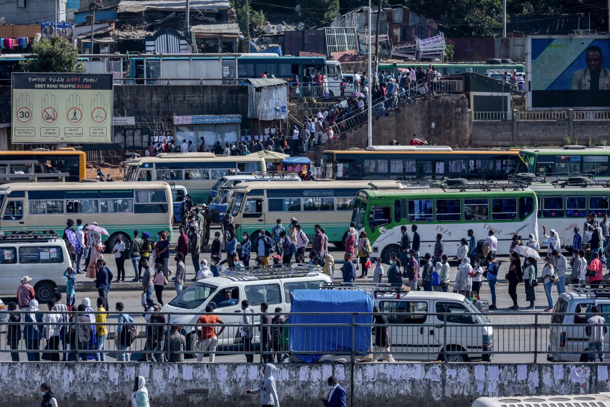 Passengers queue to get on buses in the capital Addis Ababa, Ethiopia Nov. 6, 2020.