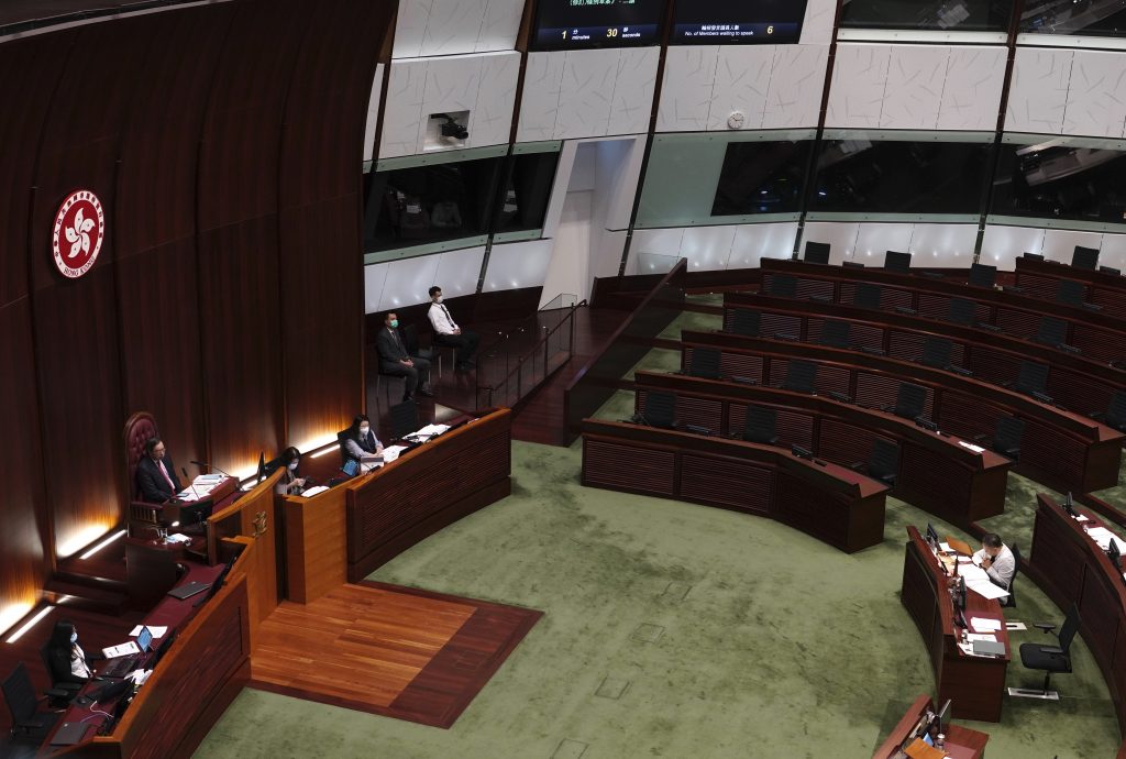 Empty seats of pro-democracy legislators, top right, are seen at Legislative Chamber in Hong Kong, Thursday day, Nov. 12, 2020. Hong Kong’s pro-democracy lawmakers announced Wednesday they would resign en masse after four of them were ousted from the semiautonomous Chinese territory's Legislature in a move one legislator said could sound the “death knell” for democracy there.