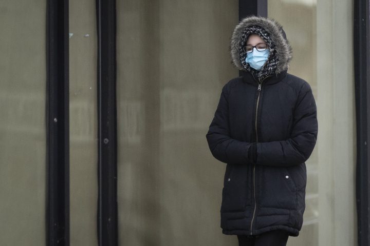 A person wears a mask in Kingston, Ontario on Monday, November 23, 2020, as the COVID-19 pandemic continues across Canada and around the world. 