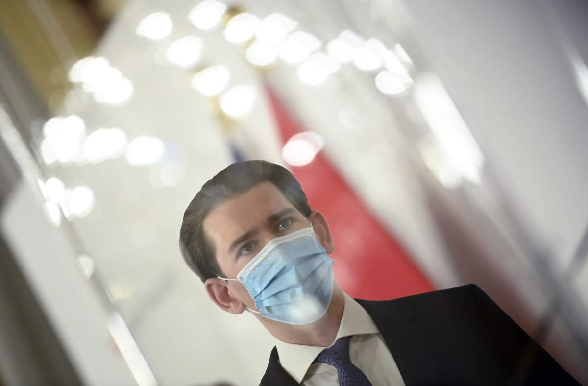 Austrian Chancellor Sebastian Kurz wears a mask during a press conference at the Austrian Chancellery in Vienna, Austria, Nov. 14, 2020.