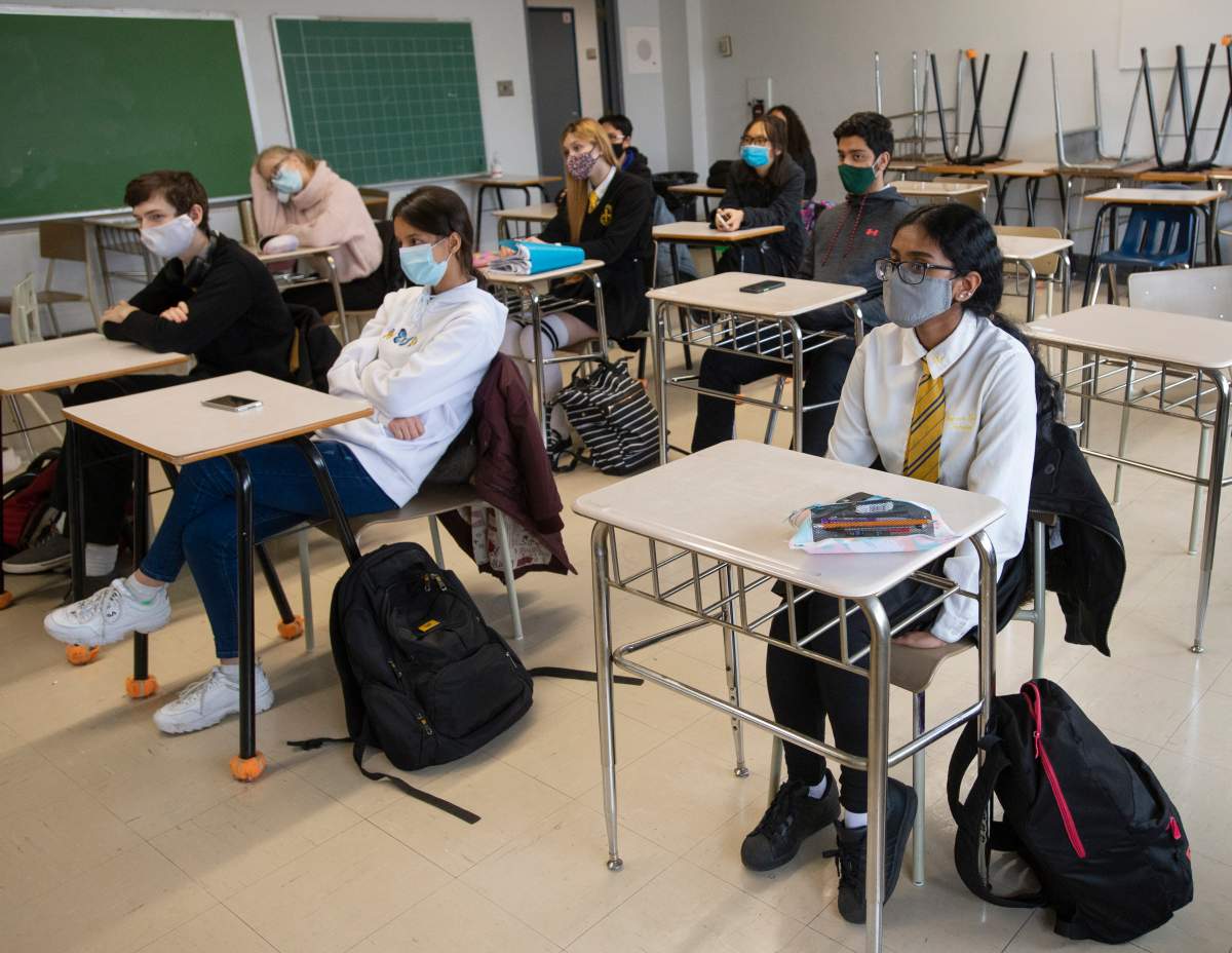High school students at Marymount Academy International wear masks as they attend class Tuesday, Nov. 17, 2020  in Montreal. 