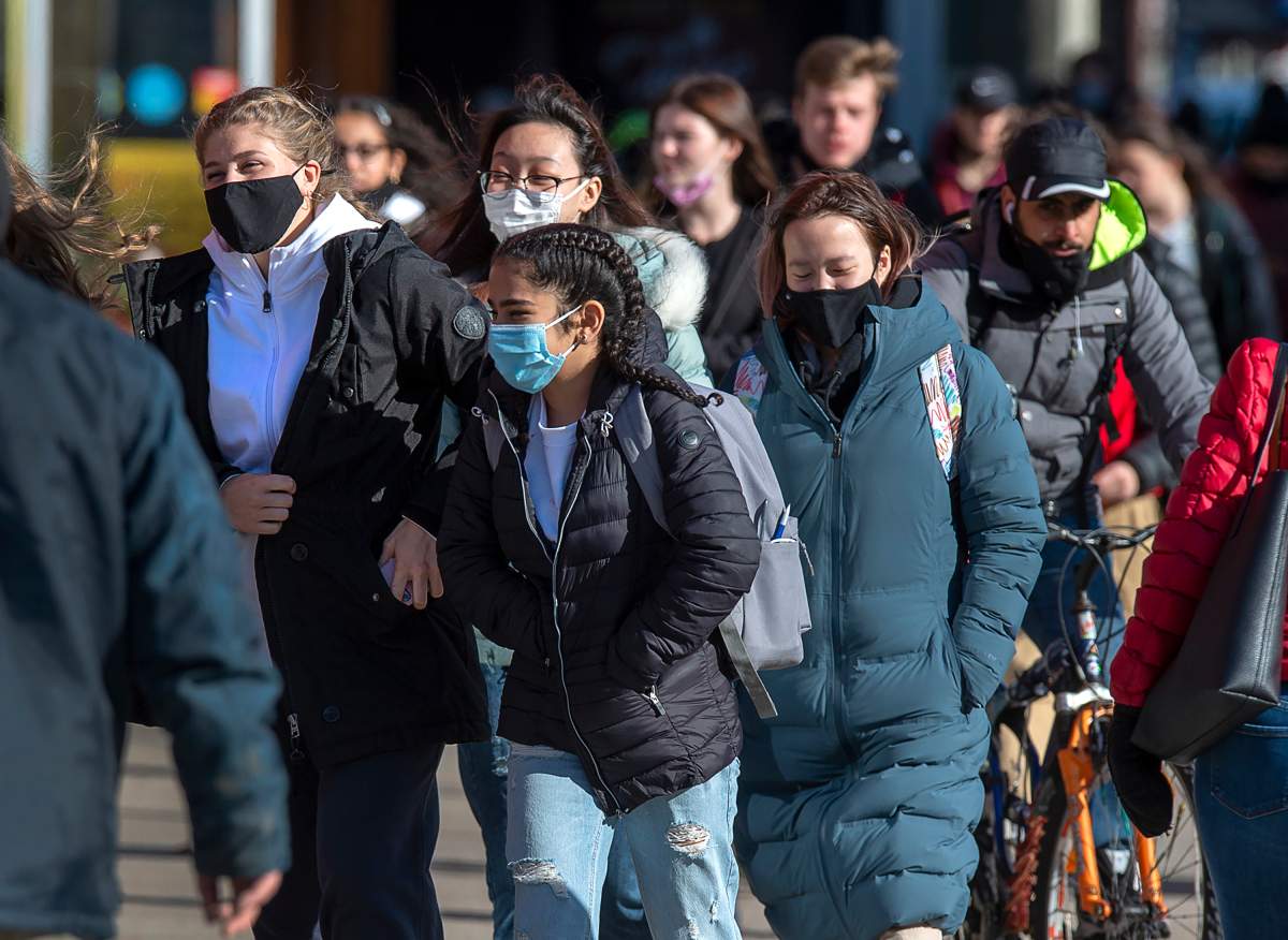 Pedestrians stroll along Spring Garden Road in Halifax on Thursday, Nov. 19, 2020. 