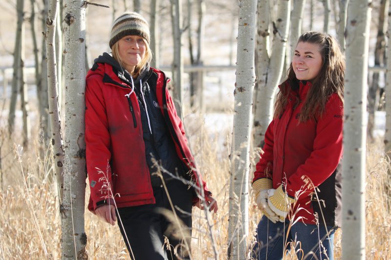 Angie Birch, sanctuary volunteer, and Alyx Harris, sanctuary manager, at the Yamnuska Wolfdog Sanctuary, Cochrane Alberta on Monday, Nov. 23, 2020.