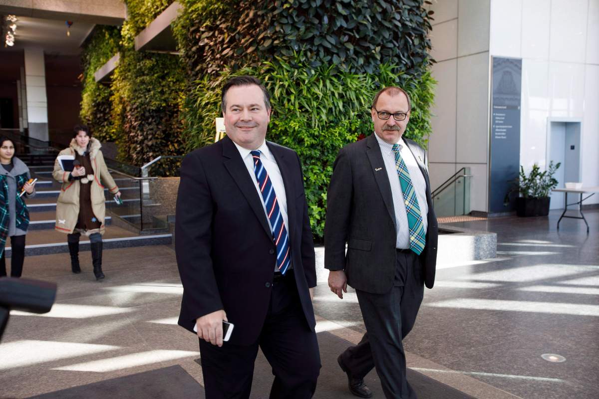 Alberta Progressive Conservative leader Jason Kenney, left, walks with former interim leader Ric McIver at the Federal Building in Edmonton, Alta., on Monday, March 20, 2017.