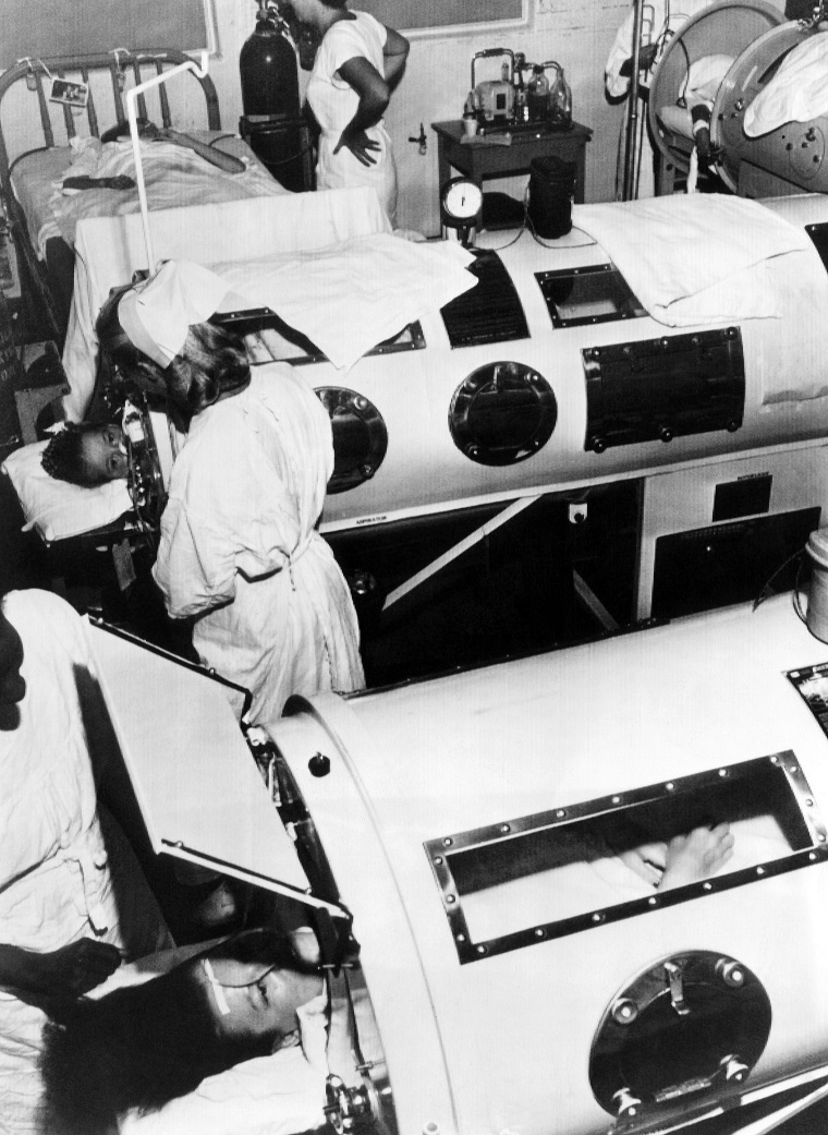 Polio patients being treated with iron lungs in a hospital ward, circa 1948. CSU Archives/Courtesy Everett Collection