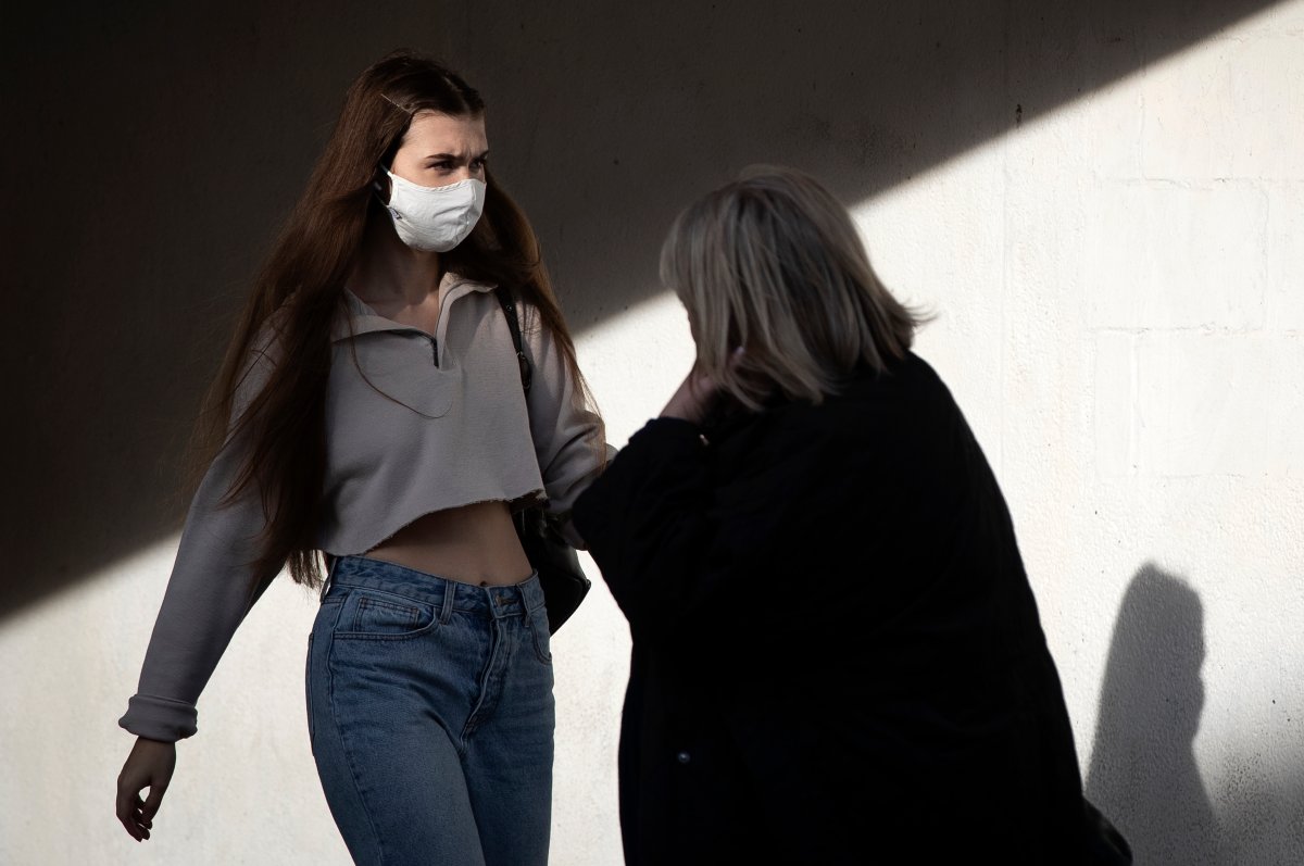 A person wears a mask in Kingston, Ontario on Friday, November 6, 2020, as the COVID-19 pandemic continues across Canada and around the world. 