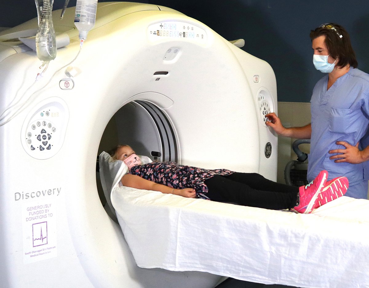 Medical radiation technologist Robert Hurford directs young “patient” Elise Verge in a preview of a CT exam at Penticton Regional Hospital.  The South Okanagan Similkameen Medical Foundation’s Tree of Dreams campaign looks to raise the final $500,000 needed for a second CT at PRH.