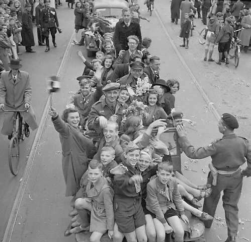 Dutch civilians celebrating liberation of Utrecht by units of the 1st Canadian Corps, 7 May 1945