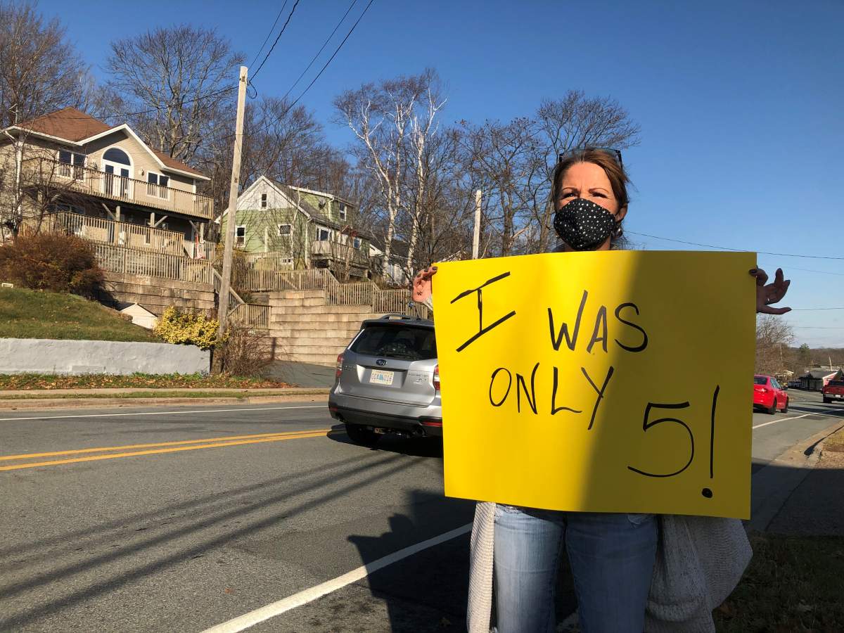Christine Shupe, a former patient of Halifax-area dentist Dr. Errol Gaum, says she was five years old when Gaum allegedly slapped her in the face. She joined other former patients in a protest in Bedford, N.S. on Nov. 21, 2020.