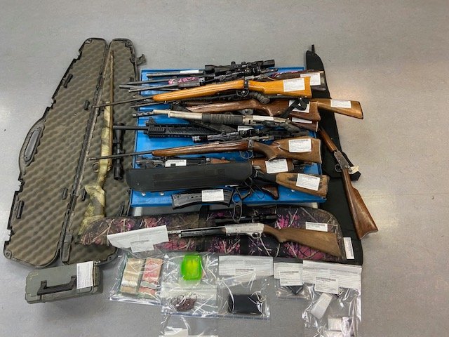 A haul of guns and other contraband Manitoba RCMP say they seized while executing a search warrant at a home in Dauphin.