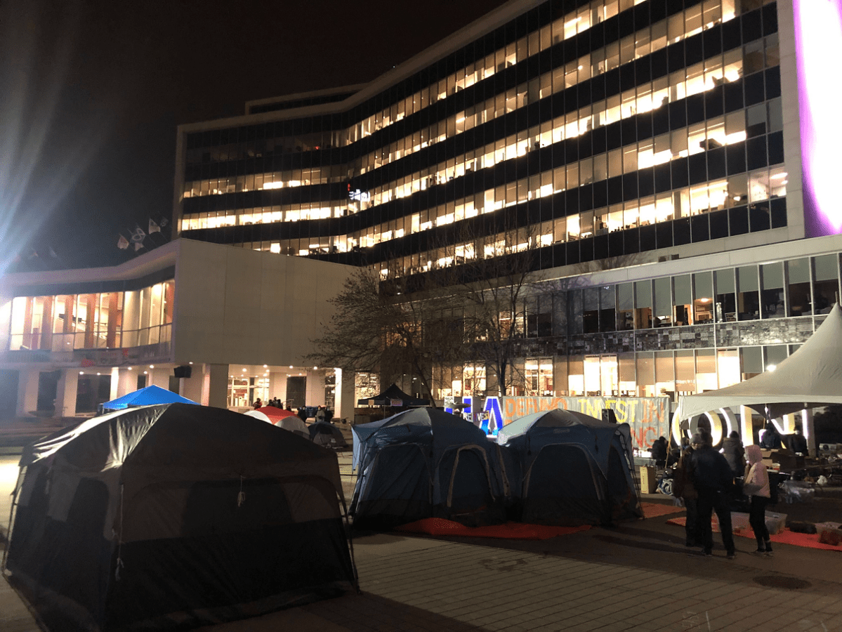 Protesters camp out in tents in front of Hamilton city hall, calling for the defunding of police.