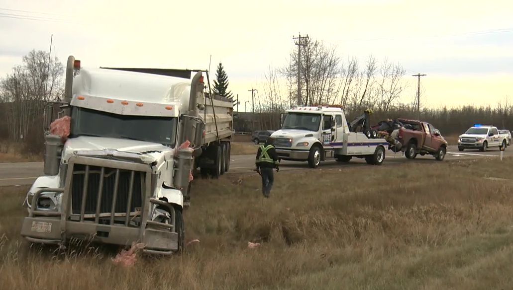 A crash between a red pickup and a semi dump truck happened north of Devon on Highway 60 around 12:30 p.m. Wednesday, Nov. 4, 2020.