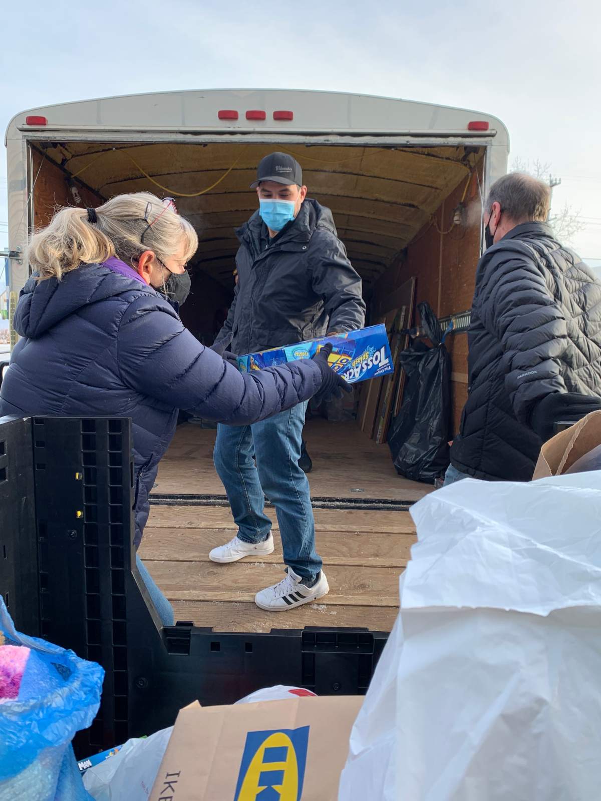 630 CHED Santas Anonymous staff, volunteers and the Topilko family unload the donations 10-year-old Connor Topiliko collected for the charity.