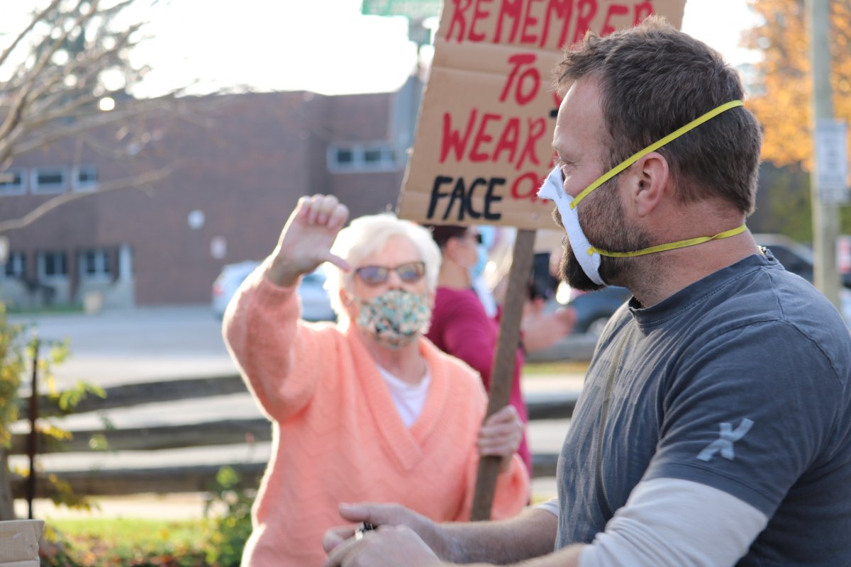 Aylmer Ont. residents opposed to the demonstration lined the streets with some heated moments between residents who did not want the anti-mask rally in their town. Nov. 7, 2020.