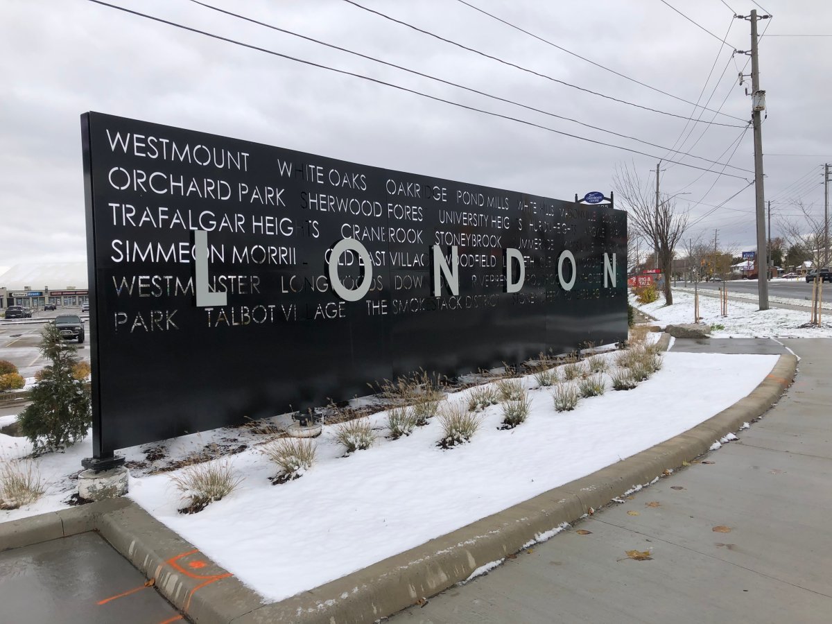 Snow lays at the base of a sign of London, Ontario in the city's south end on Nov. 2, 2020.