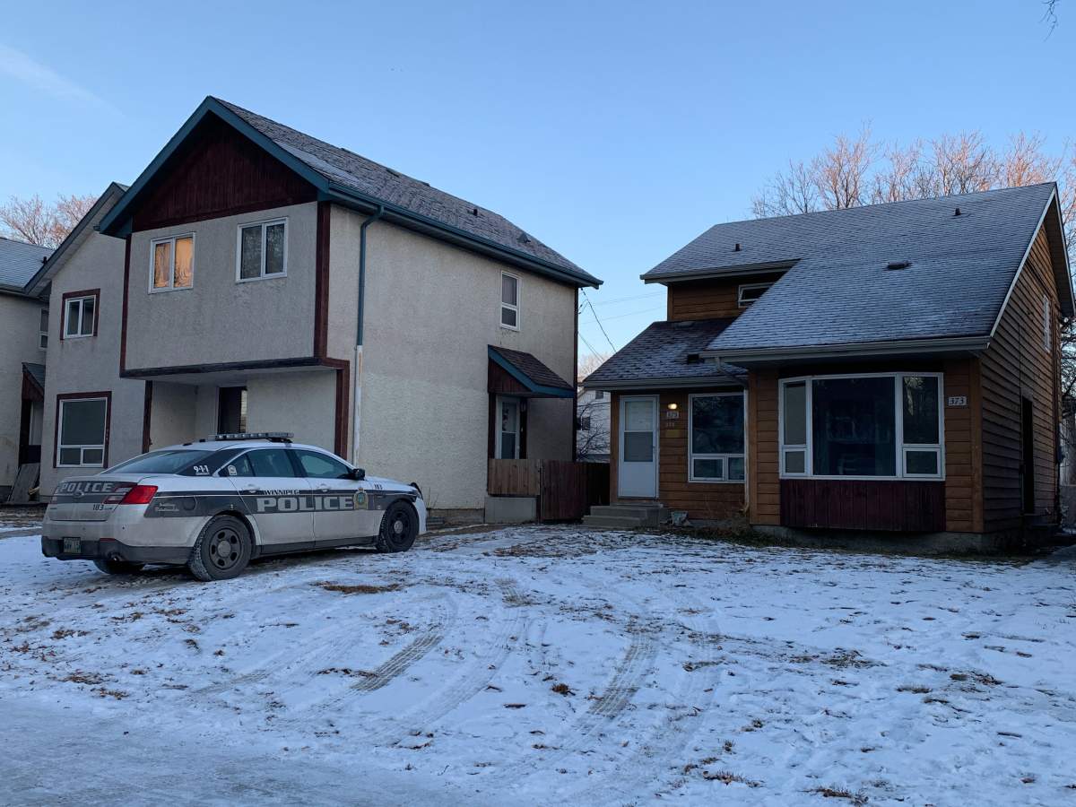 Winnipeg police at the scene on Ross Avenue on Monday, Nov. 30, 2020.