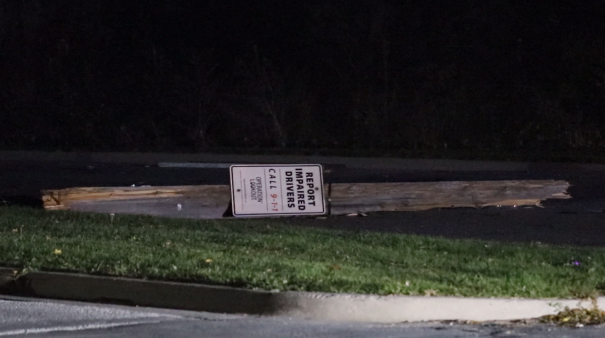 Kingston police have charged a man with impaired driving after his car struck a hydro pole sporting a sign that said 'Report Impaired Drivers.'.