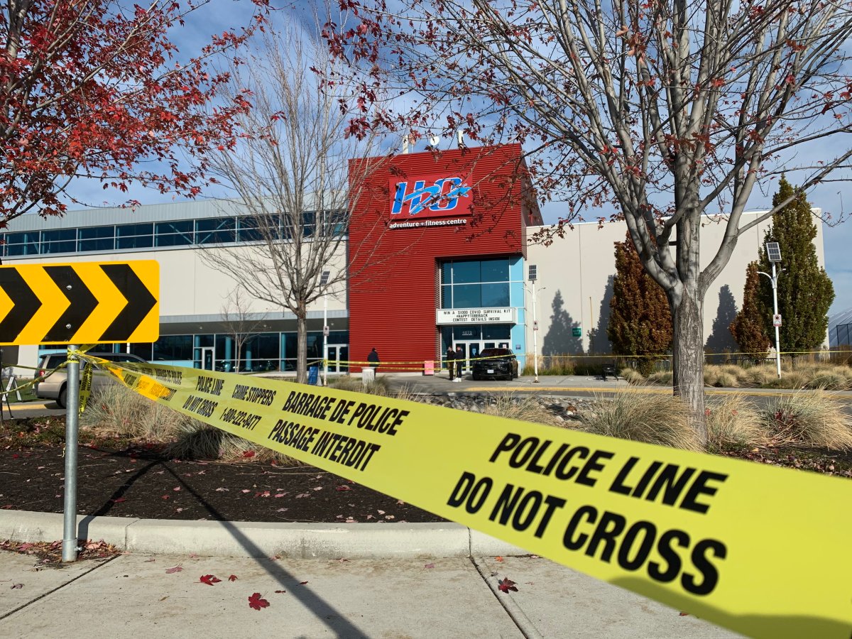 Blood splatter, police tape and evidence markers were visible on the concrete near the H2O fitness centre in Kelowna, B.C. after an attack on Halloween. 