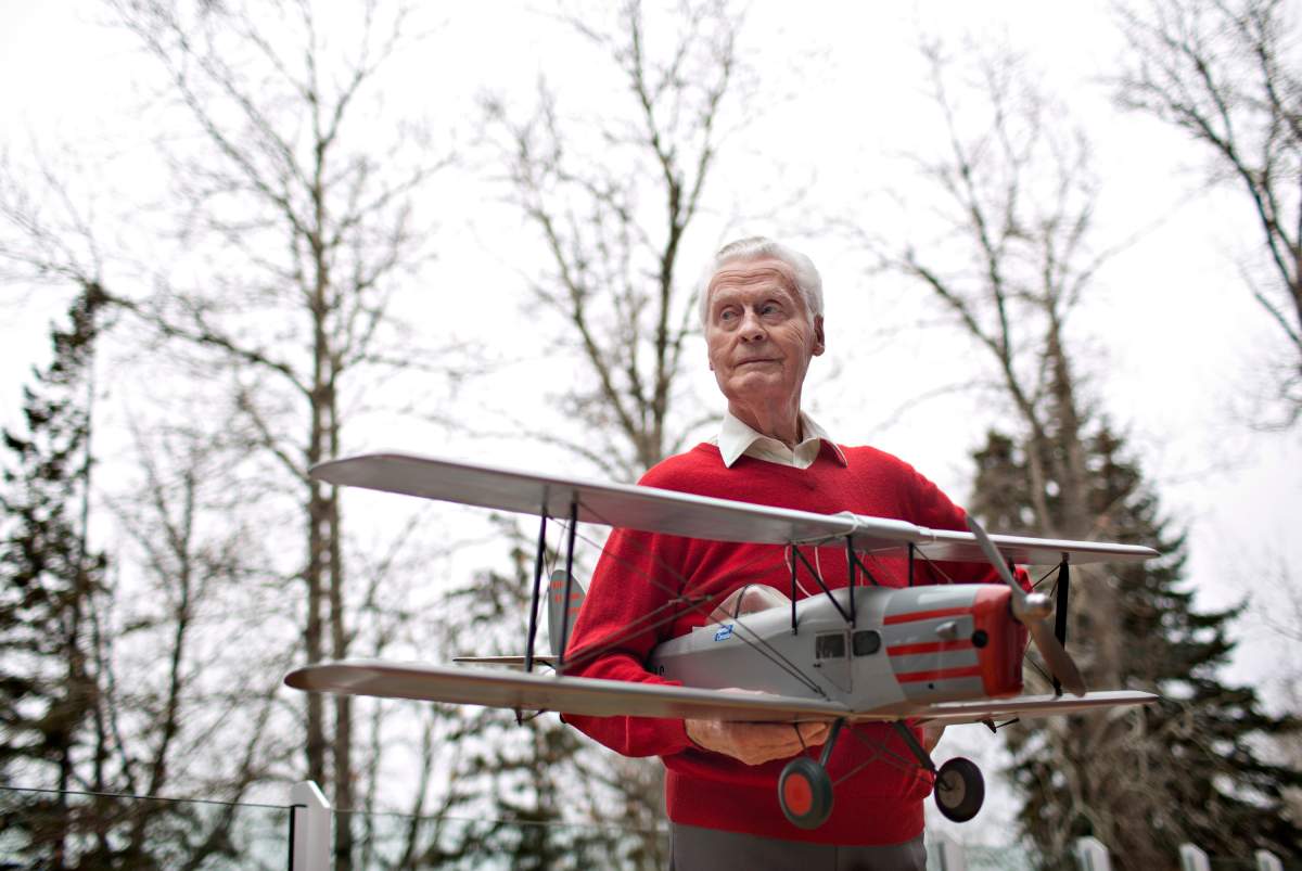 Max Ward pictured with a model of his first plane, the De Havilland Fox Moth CF-DJB, in Edmonton Alta, on Tuesday November 17, 2015.