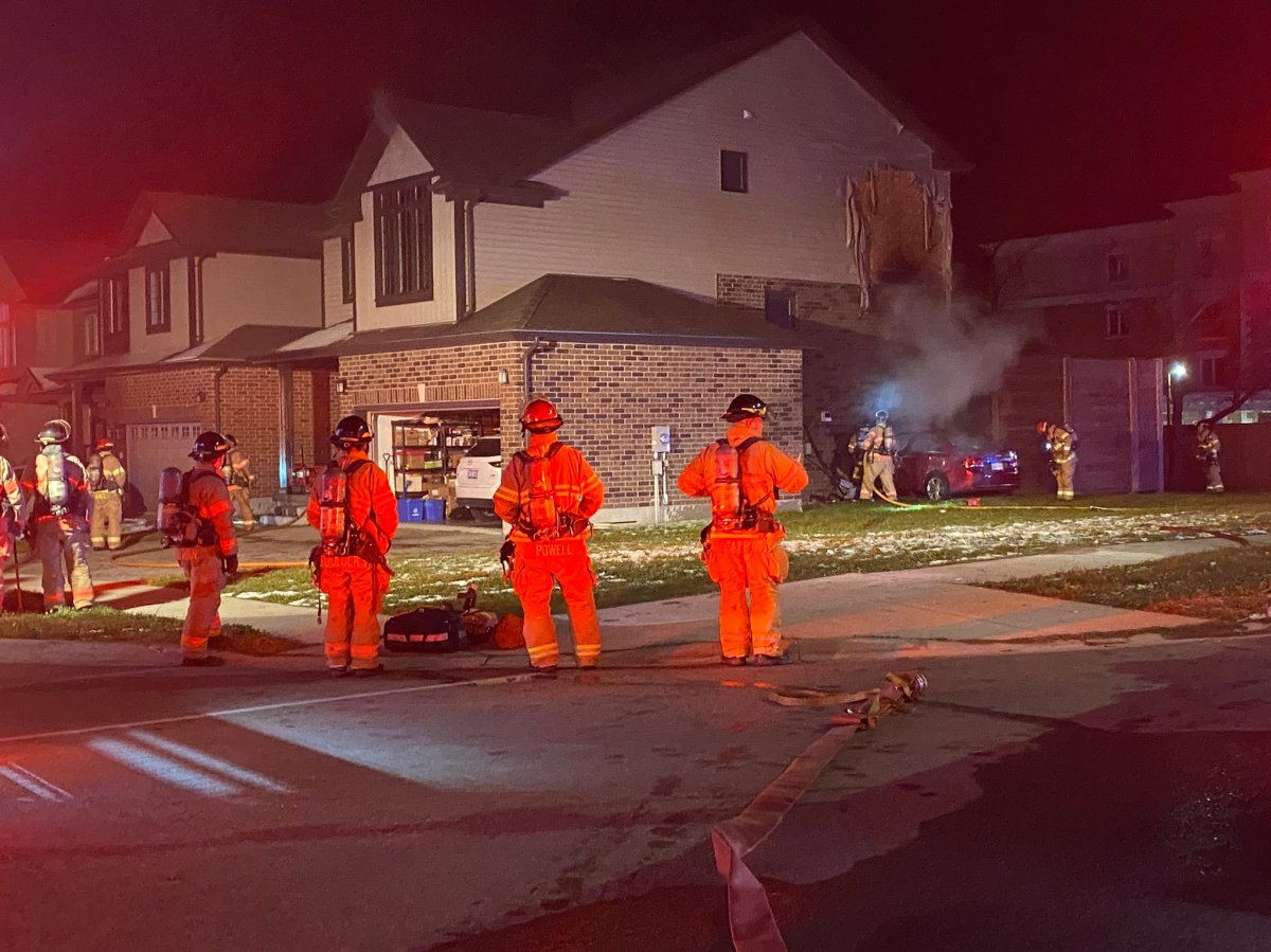 London firefighters respond to a collision between a car and a home on Oakcrossing Gate at Sarnia Road on Tuesday, Nov. 3, 2020. 