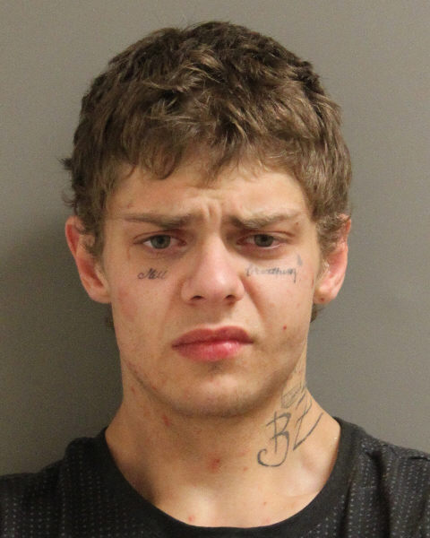 An arrest warrant was issued for Dustin Mitchell, 25, of Red Deer.