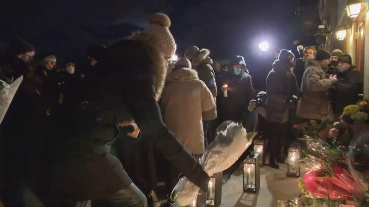 Mourners gather in Quebec City to pay homage to the victims of a sword attack over the weekend. Monday, Nov. 2, 2020.
