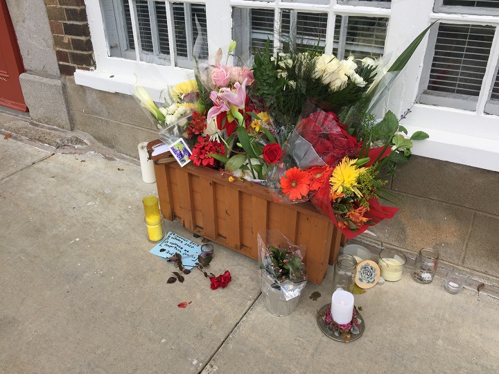 A makeshift memorial is seen on des Remparts Street, where Suzanne Claremont,61, was fatally stabbed on Halloween night in 2020.