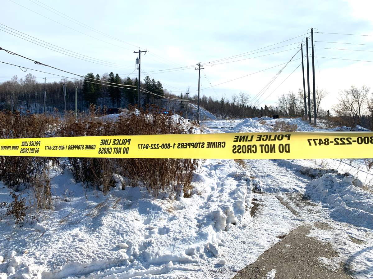 Edmonton police tape blocking off access to the North Saskatchewan River after a body was found on an ice flow near the Dawson Bridge on Thursday, Nov. 12, 2020. 