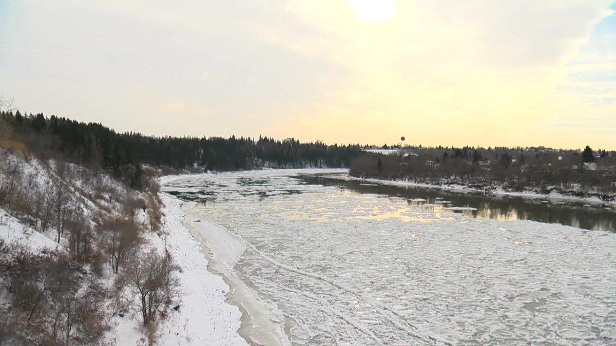 Edmonton police investigating at the North Saskatchewan River after a body was found on an ice flow near the Dawson Bridge on Thursday, Nov. 12, 2020. 