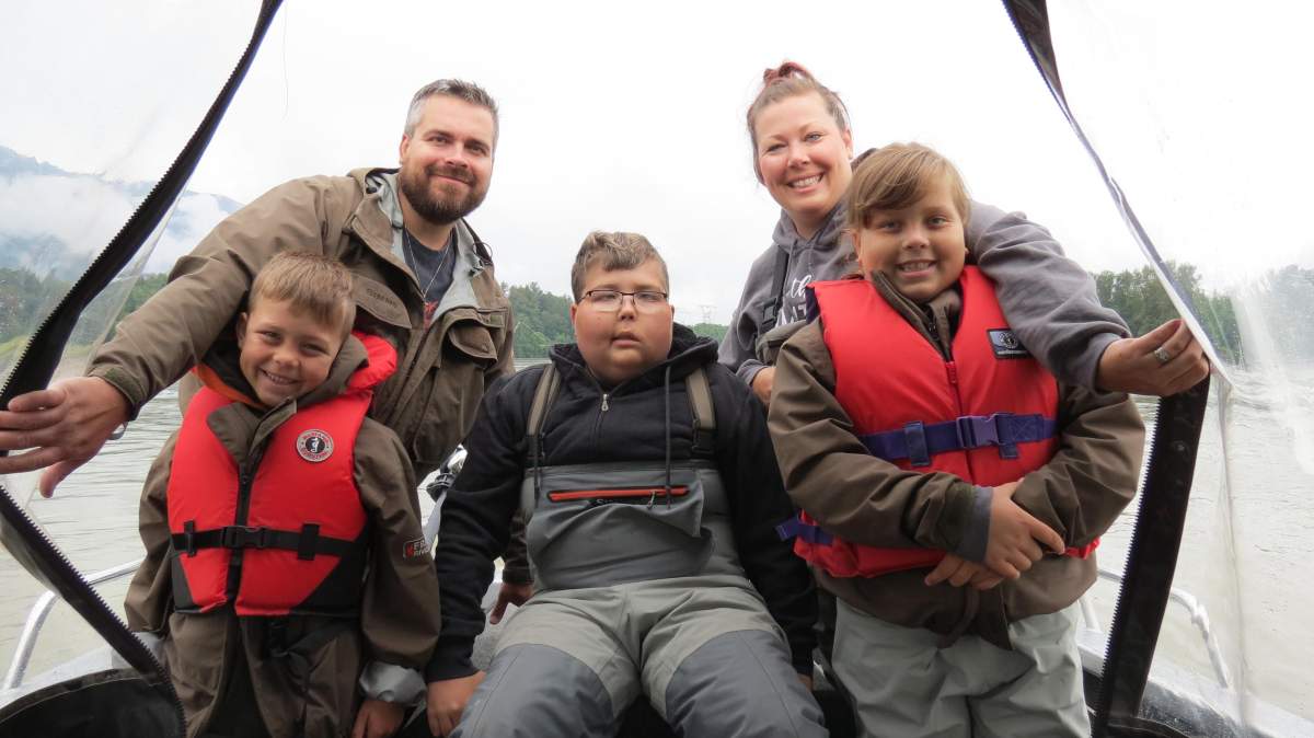 Tyler and his family on a fishing trip