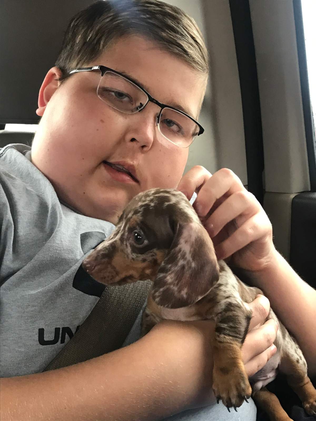 Tyler Palmowski and one of his new puppy