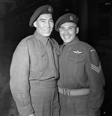 Tommy Prince (right) with a brother at Buckingham Palace, where he was awarded two gallantry medals.