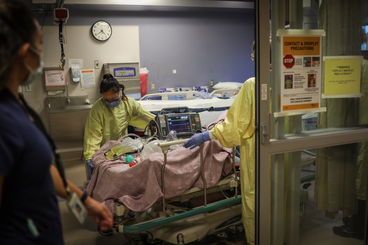 Nurses in personal protective equipment (PPE) treating a COVID-19 patient in the Intensive Care Unit (ICU) at the Peter Lougheed hospital in Calgary on November 14, 2020. 